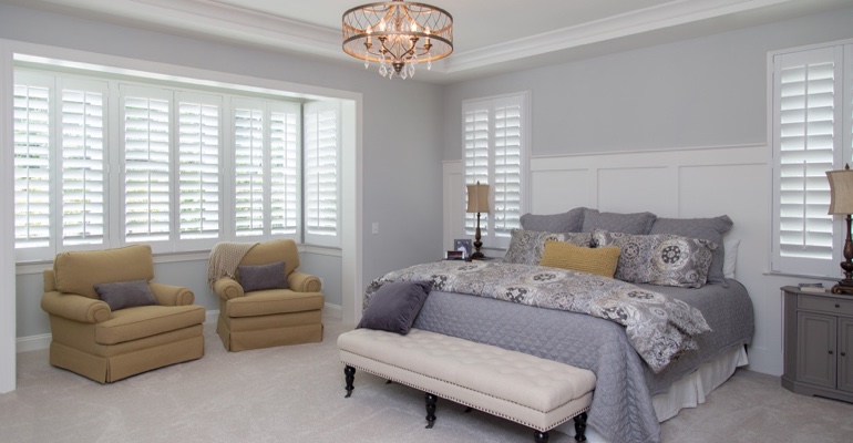 Plantation shutters in Austin bedroom.